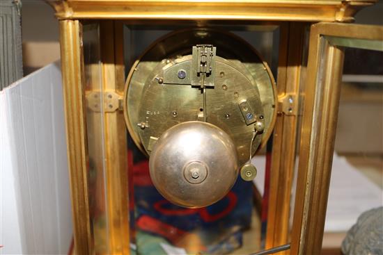 A French gilt brass four glass mantel clock, with white enamelled Roman chapter ring, H 14in